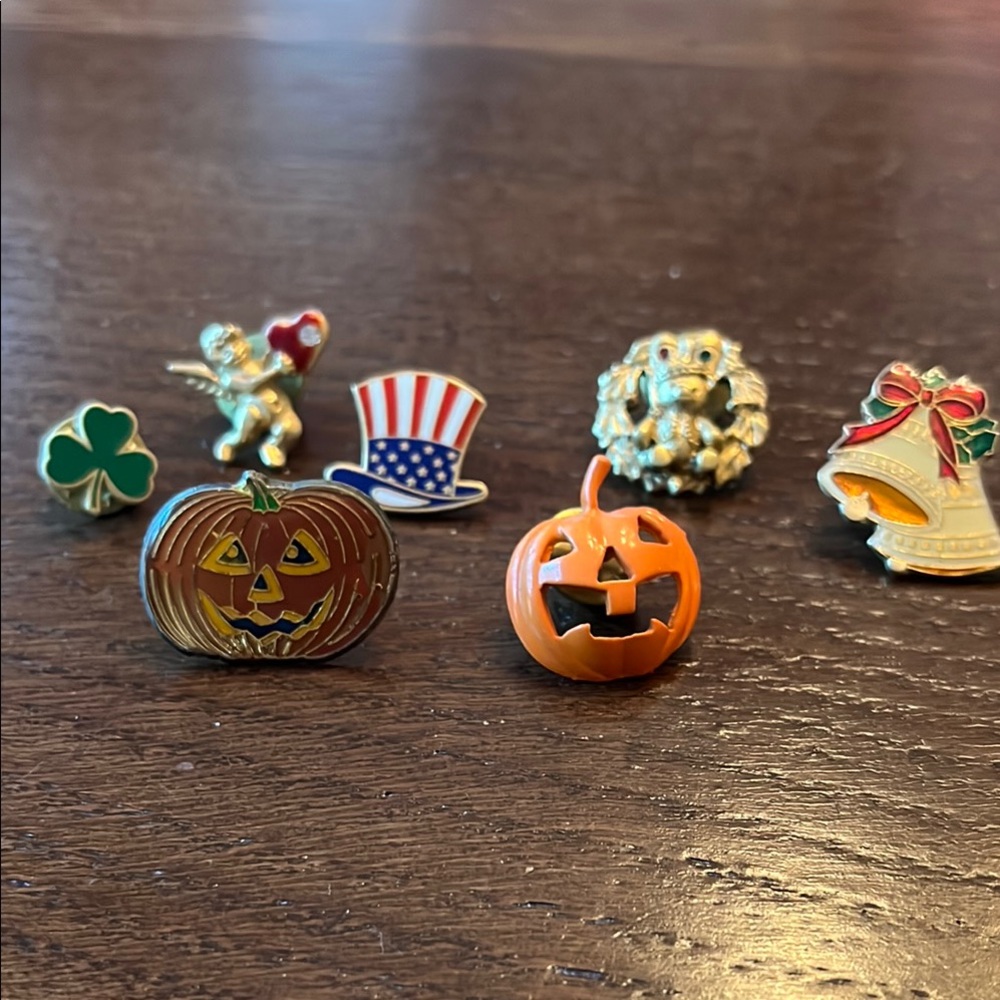 Six Holiday Pins- jack o’lanterns, St.Pat’s Shamrock, July 4 U. Sam., Xmas bells